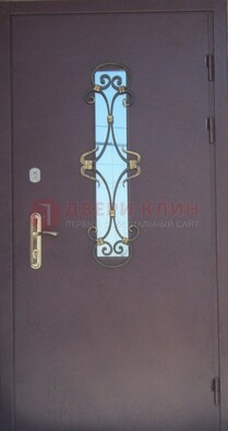 Металлическая дверь со стеклом и ковкой ДСК-77 в Казани