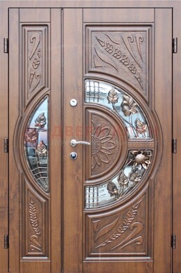 Уличная дверь в цвете Итальянский орех с виноритом и ковкой со стеклом ДВТ-147 в Казани
